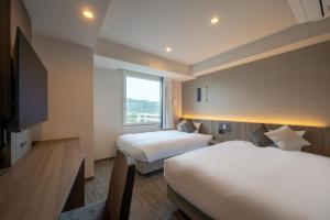 SAKURA PORT HOTEL客房内的一张或多张床位