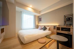 SAKURA PORT HOTEL客房内的一张或多张床位