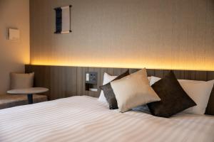 SAKURA PORT HOTEL客房内的一张或多张床位