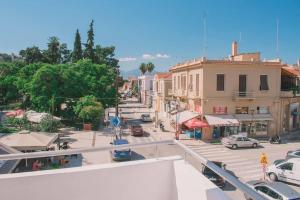 a view of a city street with cars and buildings at Theasis Luxury Apartment in Nafplio