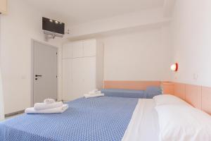 Postel nebo postele na pokoji v ubytování Hotel Altamarea