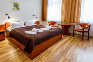 Postel nebo postele na pokoji v ubytování Villa Antares I & II