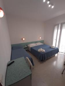 Postel nebo postele na pokoji v ubytování Hotel Altamarea