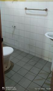 a bathroom with a toilet and a sink at Isuruma Rest in Kataragama