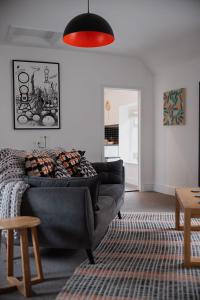 a living room with a couch and a table at No. 82 Grade II Listed Norwich City Centre Flat in Norwich