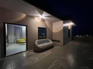 a room with a chair in the middle of a building at MonGite in Cotonou