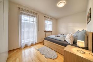 A bed or beds in a room at FaWa Apartments "Family"