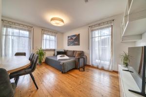 a living room with a couch and a table at FaWa Apartments "Family" in Brunico