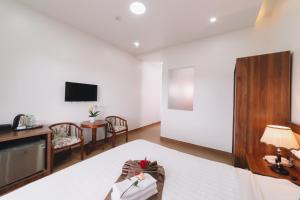 TV a/nebo společenská místnost v ubytování Anh Duc Hotel Da Lat City