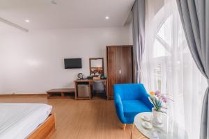 TV a/nebo společenská místnost v ubytování Anh Duc Hotel Da Lat City