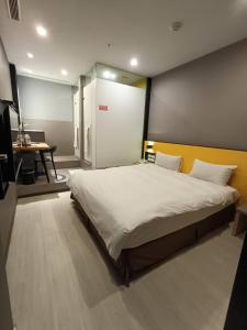 Letto o letti in una camera di Walker-Taoyuan