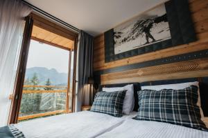 Posteľ alebo postele v izbe v ubytovaní New Apartamenty Jan