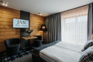 Posteľ alebo postele v izbe v ubytovaní New Apartamenty Jan