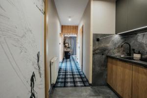 Kuchyňa alebo kuchynka v ubytovaní New Apartamenty Jan