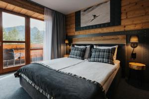 Posteľ alebo postele v izbe v ubytovaní New Apartamenty Jan
