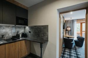 Kuchyňa alebo kuchynka v ubytovaní New Apartamenty Jan
