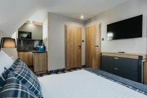 Posteľ alebo postele v izbe v ubytovaní New Apartamenty Jan