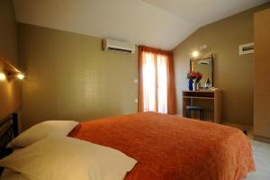Postel nebo postele na pokoji v ubytování Maria Hotel