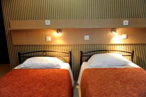 Postel nebo postele na pokoji v ubytování Maria Hotel