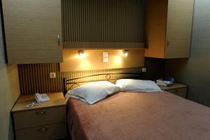 Postel nebo postele na pokoji v ubytování Maria Hotel