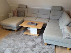 a living room with a couch and a coffee table at Apartment Bochum in Bochum