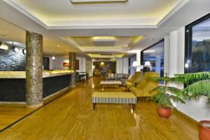 a lobby of a hotel with a living room at Hillcrest Resort by DLS Hotels in Shimla