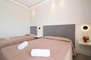 Postel nebo postele na pokoji v ubytování Maria Hotel
