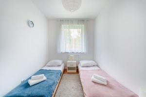 Vuode tai vuoteita majoituspaikassa Baltica Maczka 2-Bedroom Apartment