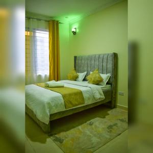 Un ou plusieurs lits dans un hébergement de l'établissement AA luxury Home Nakuru