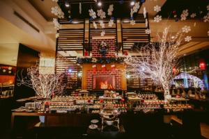 a table in a room with christmas decorations at Novotel Ha Long Bay Hotel in Ha Long +181 photos