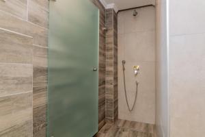 Koupelna v ubytování Maria Hotel