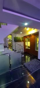 a house with a glass floor and a purple ceiling at HEN - CAP SERVICED APARTMETS in Agege