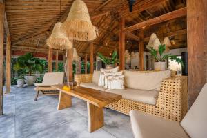 an outdoor living room with a wooden ceiling at Villa Almar in Dalung +40 photos