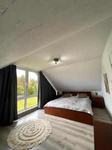 Postel nebo postele na pokoji v ubytování Dębowy Zakątek