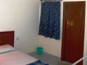 Ένα ή περισσότερα κρεβάτια σε δωμάτιο στο Hotel Casa Di William Khajuraho