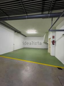 an empty parking garage with a green floor at Villa mirador de Sanxenxo in Sanxenxo