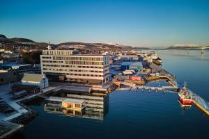 an aerial view of a harbor with a boat in the water at Scandic Sortland in Sortland +127 photos