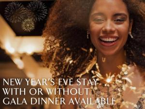 a woman smiling while wearing a new years eve stay with or without cala dinner at Jumeirah Zabeel Saray in Dubai