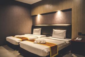 Postel nebo postele na pokoji v ubytování CK Resort Pattaya