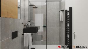 een badkamer met een wastafel en een douche bij KOCAK - Exklusives Apartment im Zentrum in Reutlingen