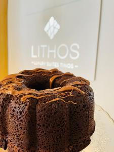 a chocolate cake sitting on top of a plate at Lithos Luxury Suites in Tinos Town