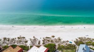 an overhead view of a beach with people on it at Playa Encantada 214 Home in Holmes Beach