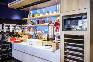 a kitchen with a counter with food on it at ibis budget Bordeaux Centre Bastide in Bordeaux