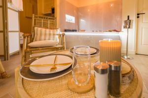 a dining room table with a plate of food on it at Welcome to Coachella / Jacuzzi in Ivry-sur-Seine