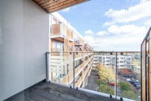 a balcony with a view of a building at The Stratford Apartments in London