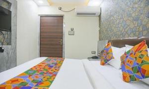 FabHotel The Treenity House客房内的一张或多张床位