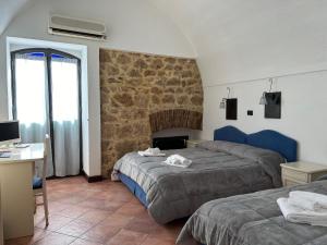 Posteľ alebo postele v izbe v ubytovaní B&B Centro Storico