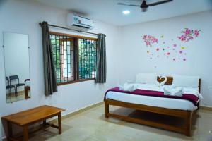 Postel nebo postele na pokoji v ubytování Idyllic Inn Calangute Goa + 5 fotografií