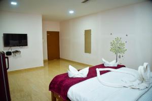Postel nebo postele na pokoji v ubytování Idyllic Inn Calangute Goa