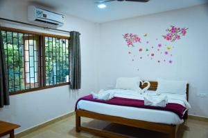 Postel nebo postele na pokoji v ubytování Idyllic Inn Calangute Goa